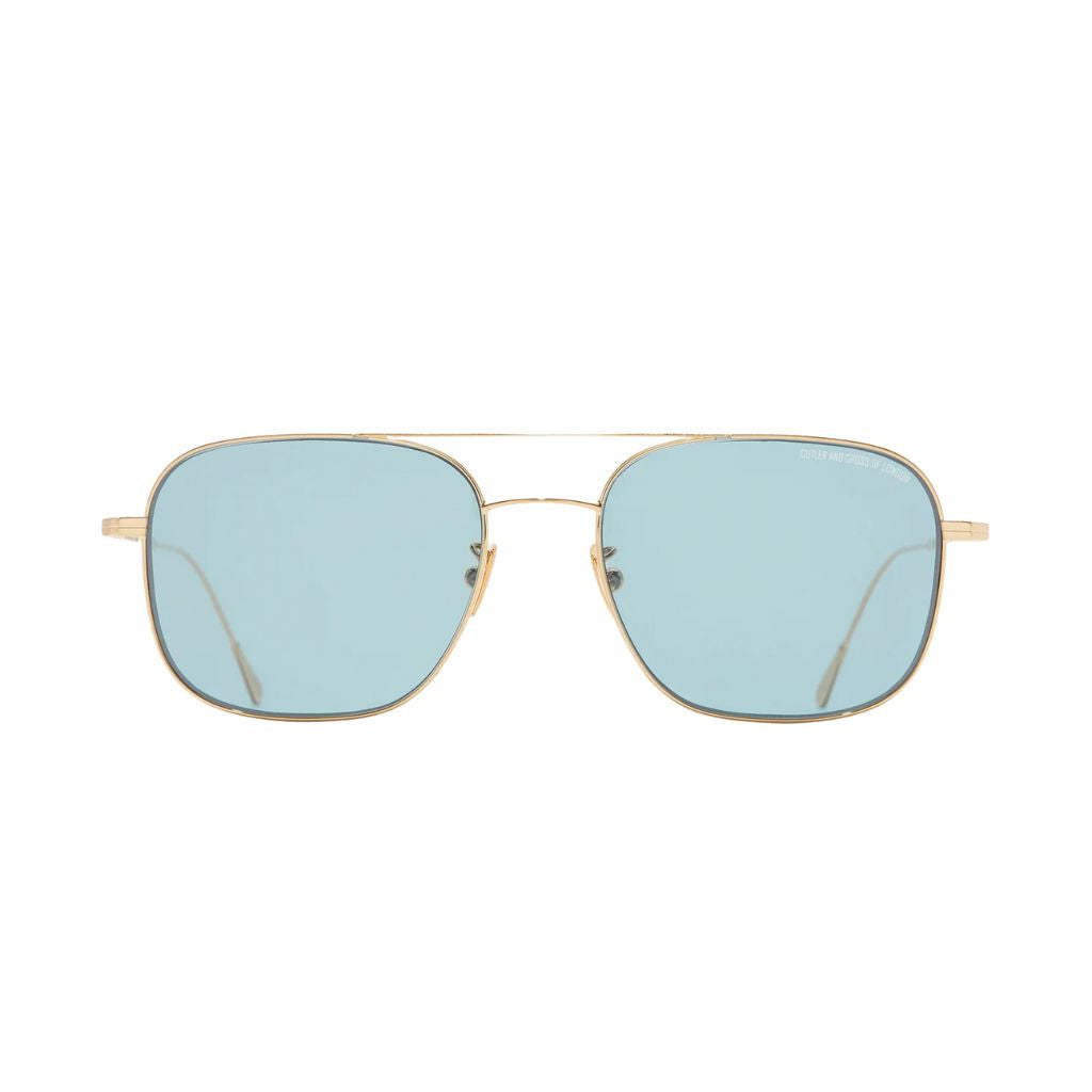Frontansicht der Cutler and Gross Aurum 0003 Sun 03 bei Brillen Schneider München – luxuriöse Sonnenbrille in 18K Gold mit blauen ZEISS Gläsern.