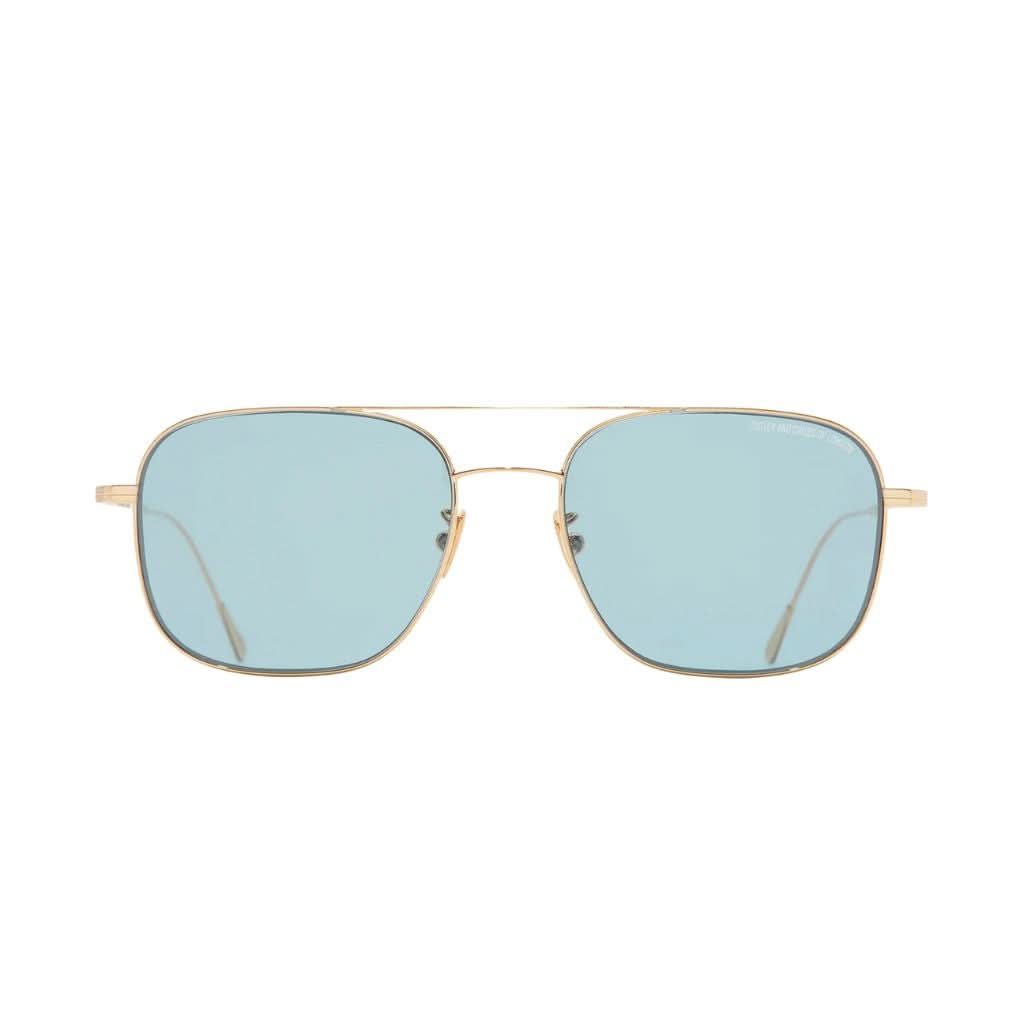 Frontansicht der Cutler and Gross Aurum 0003 Sun 03 bei Brillen Schneider München – luxuriöse Sonnenbrille in 18K Gold mit blauen ZEISS Gläsern.