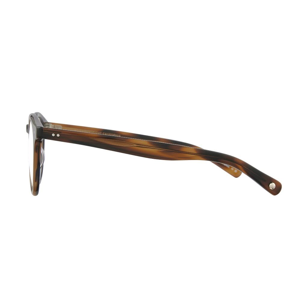 Seitenansicht der Garrett Leight Brille, Modell Clune X in der Farbe Spotted Brown, erhältlich bei Optik Bartholomä in München. Filigranes Design mit einem eleganten, gepunkteten Braun-Muster und klarer Linienführung für einen modernen Look.