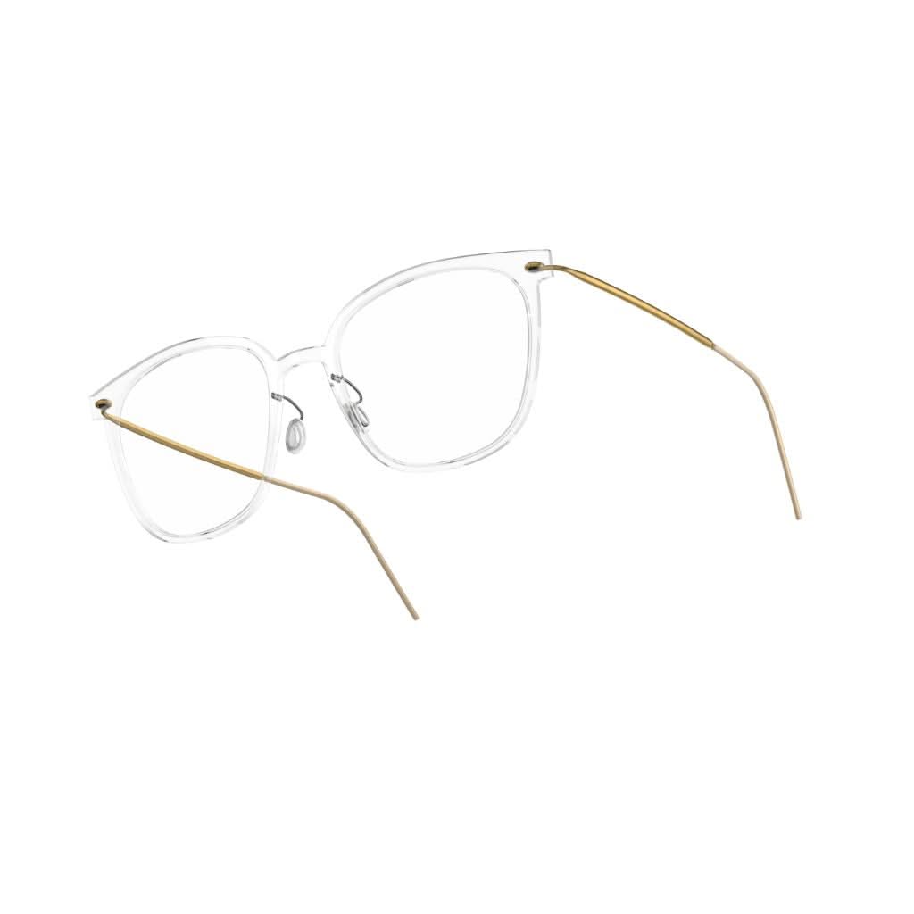 Seitenansicht: "Brille Modell 6638 C07 von Lindberg, Seitenansicht, klare transparente Acetatfassung mit goldenen Titanbügeln. Schlichte Eleganz und hochwertige Verarbeitung, erhältlich bei Brillen Schneider in München.