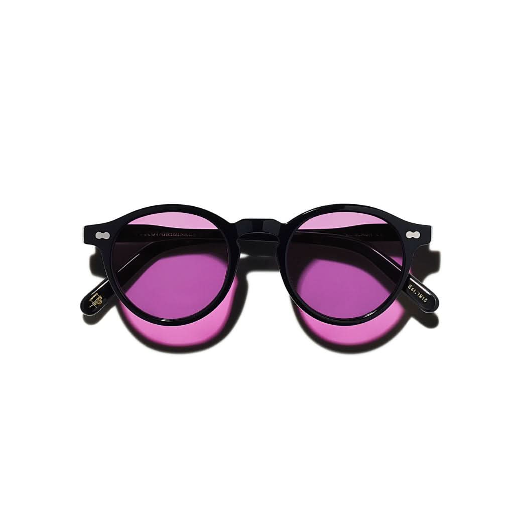 Frontansicht der Moscot Miltzen Tints Sun in Purple Nurple – runde Designer-Sonnenbrille mit violettem Farbverlauf bei Optik Bartholomä München