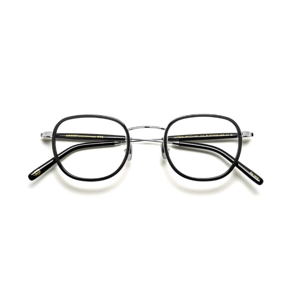 Frontansicht der Brille Mosha von Moscot in Black – eleganter Windsor-Rahmen aus schwarzem Acetat und glänzendem Metall, erhältlich bei Optik Bartholomä in München