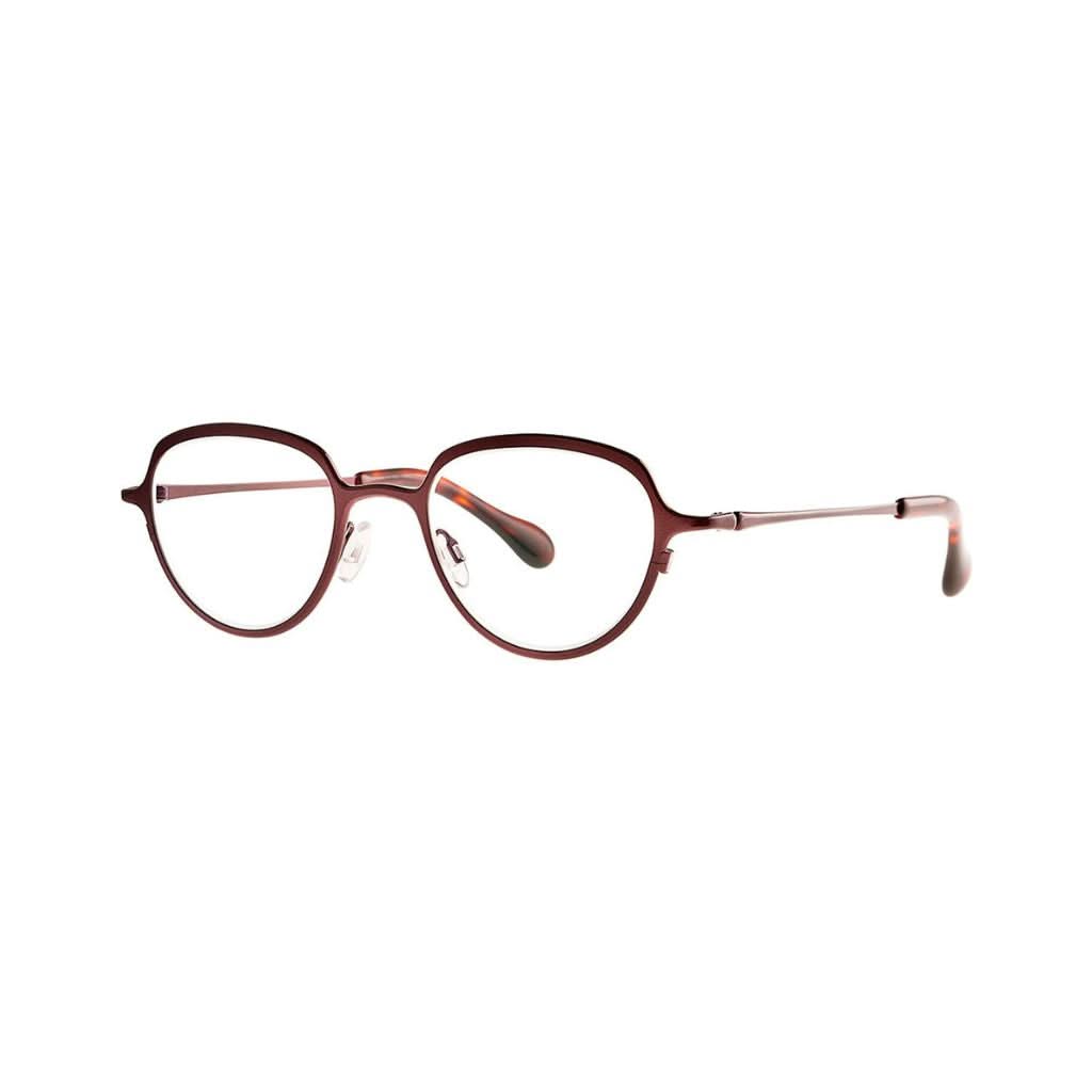 Die CESIUM 63 Brille mit dunkelroter Titanfassung und modernen Akzenten von THEO EYEWEAR, abgebildet vor einem neutralen Hintergrund – erhältlich bei BRILLEN SCHNEIDER in München.