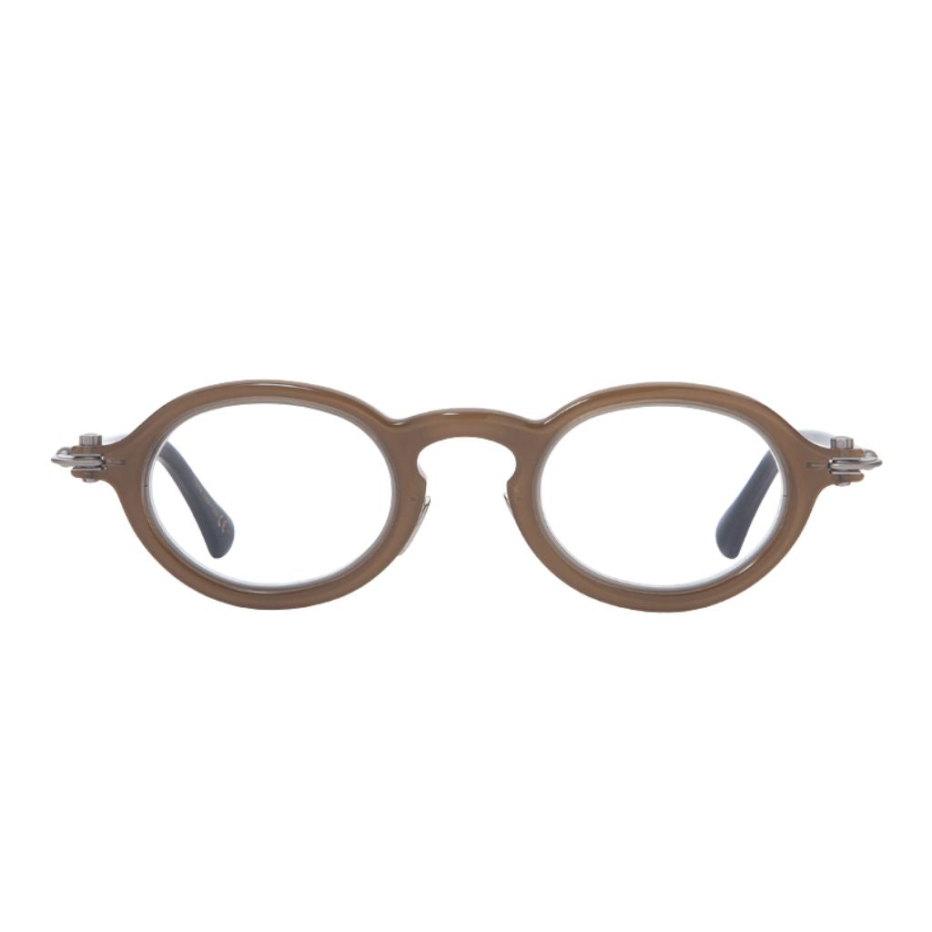 TAVAT Eyewear Token Cappuccino Frontansicht – ovale Designerbrille aus transparent braunem Acetat mit Metall-Details. Jetzt bei Brillen Schneide entdecken - Ihr erfahrener Optiker München
